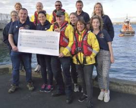 St. Michael&#039;s Rowing Club present a cheque to the RNLI at Dun Laoghaire