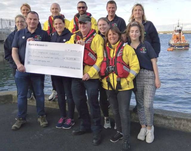 St. Michael's Rowing Club present a cheque to the RNLI at Dun Laoghaire