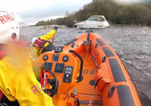 The lifeboat Douglas Euan & Kay Richards approaches the stricken vessel at an island in Upper Lough Erne