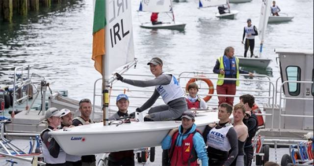 Silver medal winner Howth Yacht Club's Ewan McMahon is carried ashore at the Royal St. George Yacht Club in Dun Laoghaire