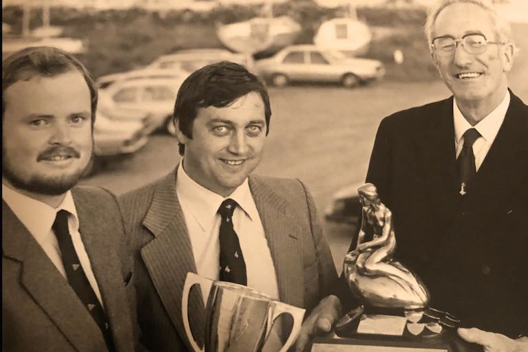 Mermaid Week 1982 at Galway Bay SC with (left to right) Pierce Purcell (GBSC), 1982 Champion Jim Dempsey (Skerries SC), and Mermaid Association President Michael Lysaght