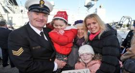 Bosun Gerry Dore is welcomed home yesterday by wife Geraldine and his daughters and mother-in-law at Haubowline Naval Base, Cork Harbour