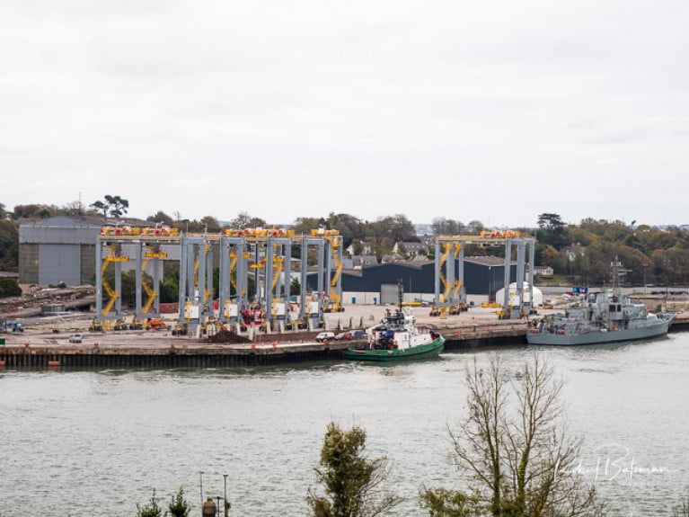 Crane assembly for Somaliland at Cork Dockyard with both a Cork Harbour tug and the Navy&#039;s LE Niamh alongside 