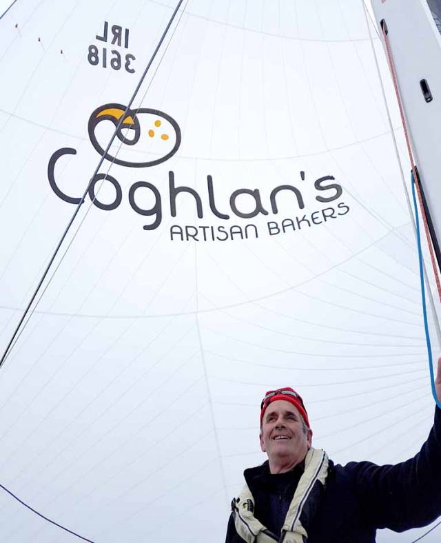 Skipper Brendan Coghlan with his new spinnaker and the sponsors graphic applied by North Sails Ireland