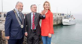 Actress Aoibhinn Garrihy whose family run Doolin2Aran Ferries at Doolin Pier Co Clare shares her local knowledge with Minister Brendan Howlin and Cathaoirleach of Clare County Council John Crowe during the Official opening of the new €6m Pier at Doolin, Co. Clare, by Brendan Howlin, T.D., Minister for Public Expenditure &amp; Public Reform earlier this year
