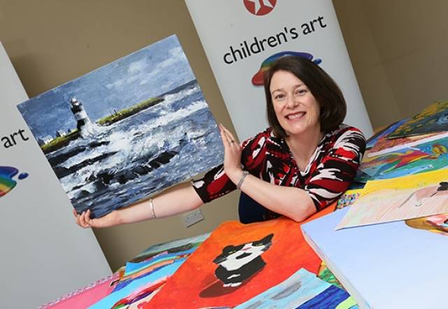 ‘Hook Lighthouse’ was painted by 15–year–old Emer O’Doherty, a pupil at Gorey Community School. Viewing the work is Valero Texaco Marketing Manager, Bronagh Carron