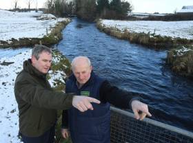 Minister Sean Kyne with local landowner Pat Ward, viewing the Grange River developments at the launch of funding for community-based angling conservation projects