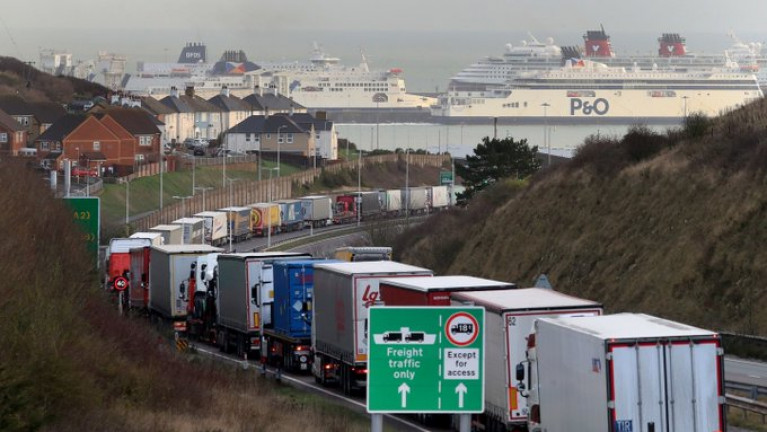 Trucks queue for the Port of Dover: Irish lorries have been caught up in road-side “stacking” of vehicles over the past week. AFLOAT adds ferry operators identified (L-R) DFDS, P&amp;O and a laid-up cruiseship Disney Magic (red funnels) of Disney Cruise Line berthed at the English south-east port in Kent. As Afloat reported last month, DFDS is to launch on 2 January 2021 a new direct freight-only route Rosslare Europort-Dunkirk to bypass post-Brexit congestion, customs checks and clearance. The Danish operator already runs a route from the north French port to Dover but with motorist passengers also included. 
