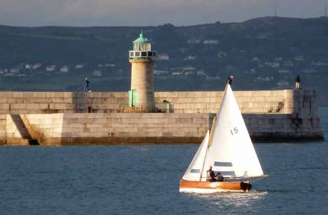 Making history. David & Sally MacFarlane sailing the 107-year-old Moosmie on their way to winning the first Water Wag race with a fleet of more than thirty boats, with Dun Laoghaire Harbour’s wonderful stonework looking its classic best