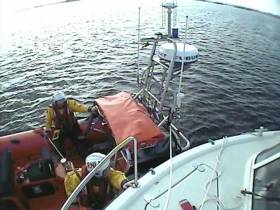 The lifeboat crew set up for tow and eased the cruiser off the rocks and into safe water