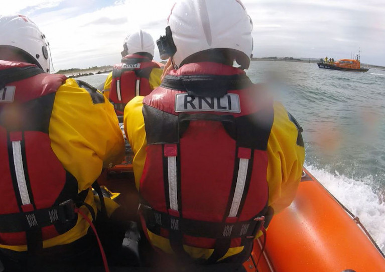 RNLI lifeboat crews from Skerries and (right) Clogherhead arriving on scene at Mornington Beach