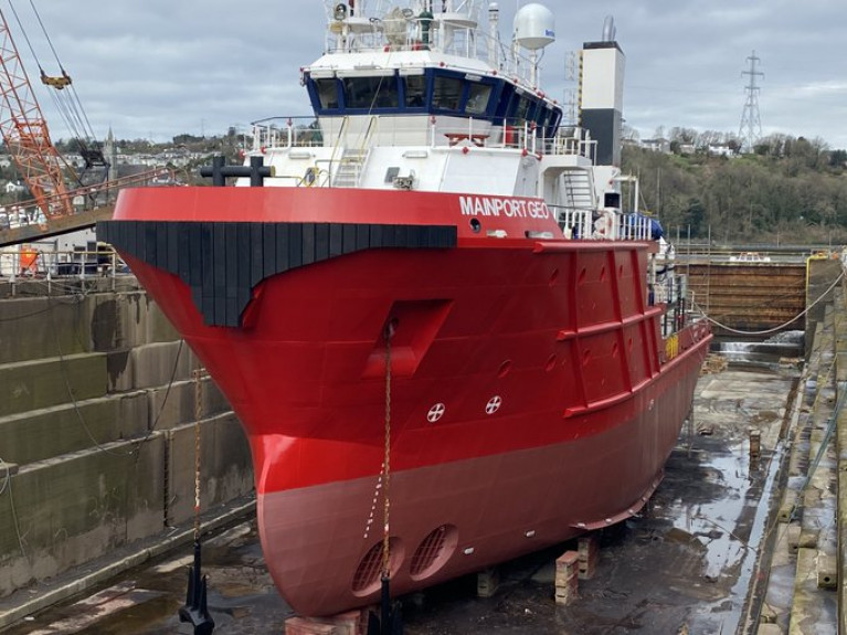 The &#039;Red Rebel&#039;: Resplendent in this Spring sunshine scene of Mainport Geo, a 50m former offshore supply ship, at Cork Dockyard following conversion into a survey/scientific vessel specifically to suit requirements of the offshore renewables sector. The facility in Rushbrooke, near Cobh was a former shipyard, but shiprepair and maintenance also remain, albeit at the nation&#039;s sole surviving graving dry-dock used for ships.