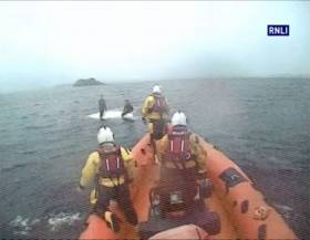 Lough Ree’s inshore lifeboat approaches the upturned Fireball and its two sailors