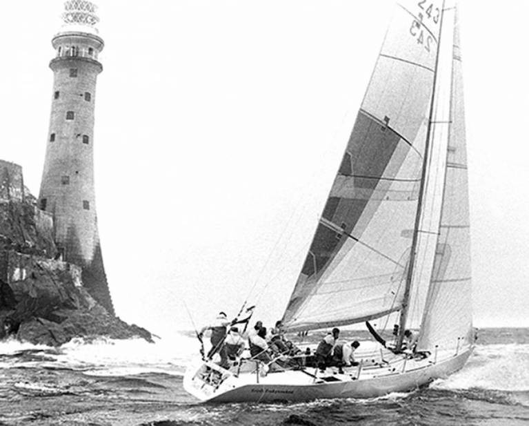  The Dubois 40 Irish Independent with Tim Goodbody as lead helm rounds the Fastnet Rock in August 1987, on the way to overall victory in the Fastnet Race. Tonight, Tim&#039;s son Richard and grandson Max will be racing rounding the Rock as crewmembers on Chris Power Smith&#039;s J/122 Aurelia in the Fastnet 450.