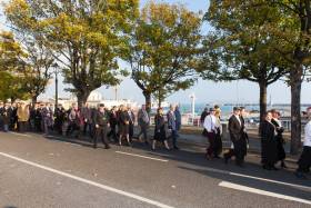 RMS Leinster: A waterfront walk of remembrance through the harbour town of Dun Laoghaire took place yesterday on the centenary anniversary of the WWI disaster. There was a great turnout for the special day where Afloat adds the procession passed close to the RMS Leinster (anchor) memorial opposite Carlisle Pier, from where the steamer departed but would never return.  Note appropriately those dressed to represent &#039;RMS&#039; passengers walk ahead of officials prior to arriving at the state ceremony held beside the dlr Lexicon Library. 
