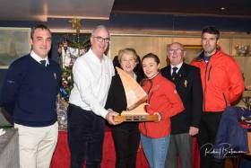 Sally O’Leary presents the Archie O’Leary Memorial Trophy to Anthony O’Leary and Sophie Browne (all in spinnaker fleet) Included are Kieran O’Connell, Rear Admiral Keelboats, Capt. Pat Farnan, RCYC Admiral and Nicholas O’Leary