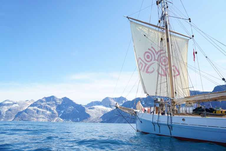  The restored Ilen in Greenland last July with her squaresail featuring the Salmons Wake logo which has become a symbol of the ship