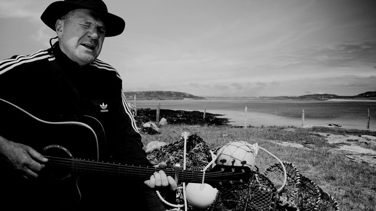 Mathematician and musician Peter Knox singing the Turbot Island song remembering the death of three fishermen in 1974 which led to the island's evacuation