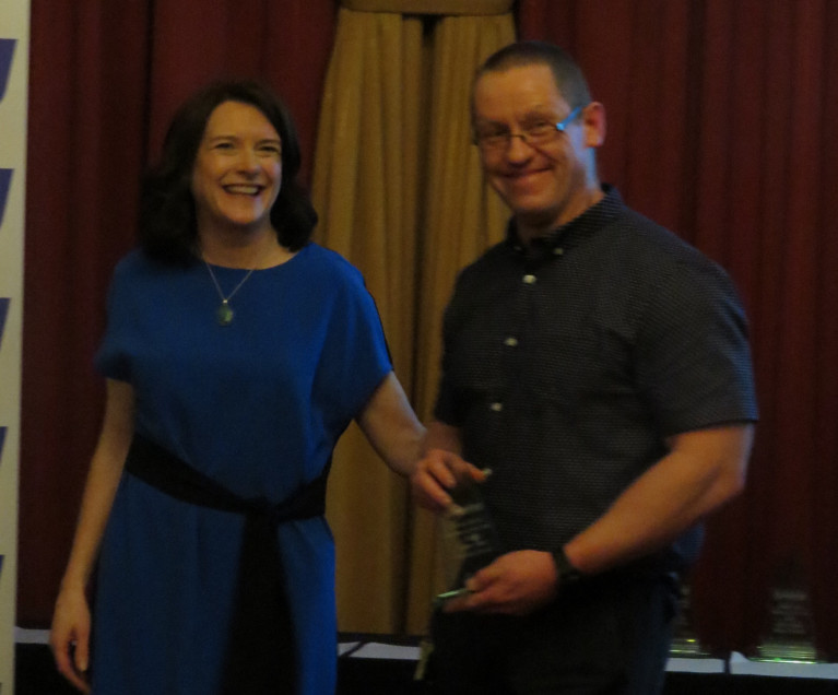 Patrick O'Leary receives his award from Miriam Malone and 