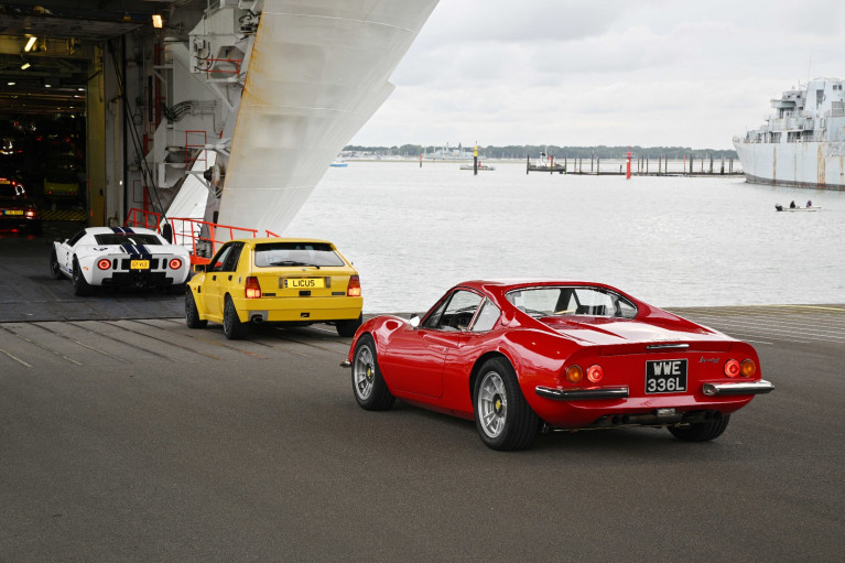 Some of the 400 classic cars seen boarding Brittany Ferries in Portsmouth to take the ferry to Caen, Normandy, from where last week the beautiful vehicles headed for the Le Mans Classic Festival. Afloat adds on right is the moored former 1970&#039;s Royal Navy destroyer HMS Bristol which became a Harbour Training Ship in the Hampshire port until decommissioned in 2020