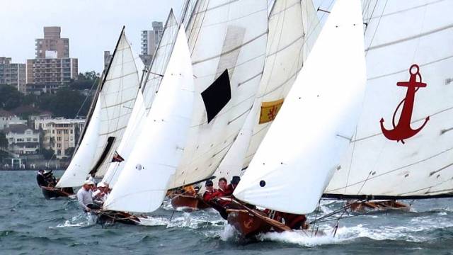 Over-canvassed, over-crewed, over-the-top…..the 1925 classic Yendys leads the vintage Sydney Harbour 18-footers