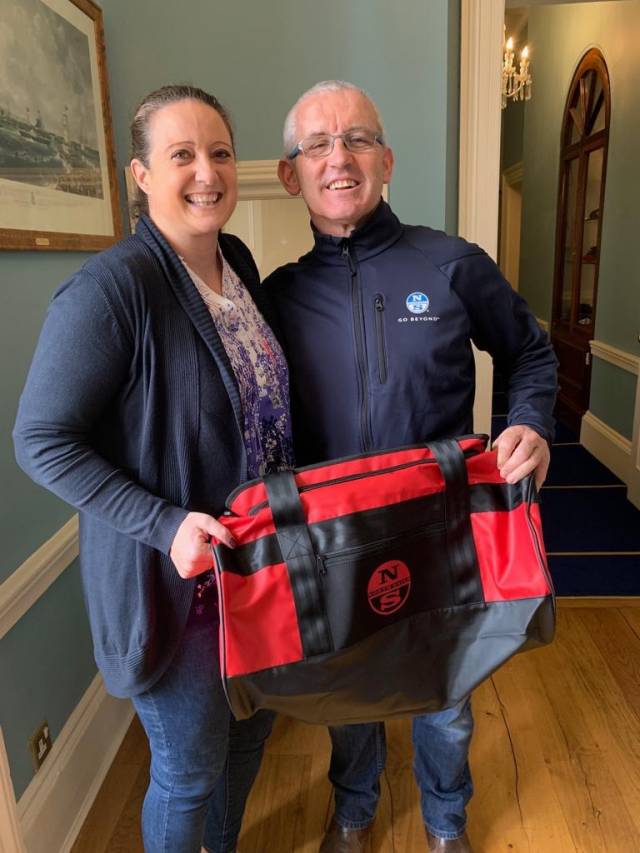 Gina Liuzzi is presented with her new North Sails Ireland holdall prize from Prof O'Connell at the Royal St. George