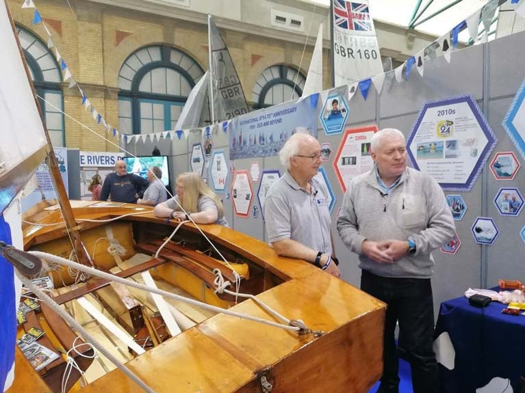GP14 Number 2 pictured with GP14 Class President Curly Morris (left) and sailing journalist Matt Sheehan at the RYA Dinghy Show