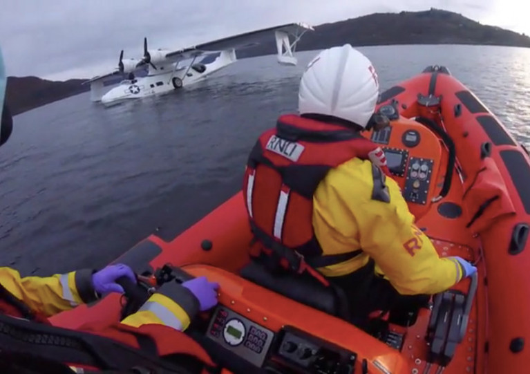 Loch Ness RNLI’s crew approach the flying boat with engine trouble