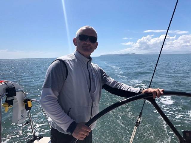 Prof O'Connell at the helm of Royal St. George yacht ISORA yacht Aurelia