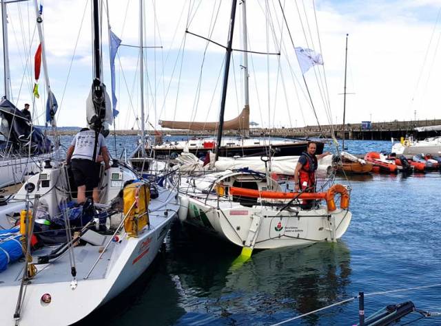 Co-skipper urgently needed…..Yannick Lemonnier aboard the Mini 6.50 Port of Galway in Dun Laoghaire alongside Liam Burke’s Farr 31 Tribal, also from Galway