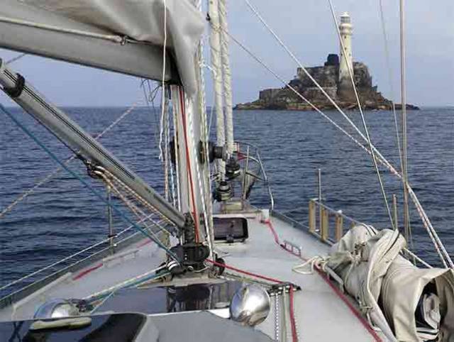 Fastnet Rock in calm waters at the start of the 109–day voyage on 12m Pylades