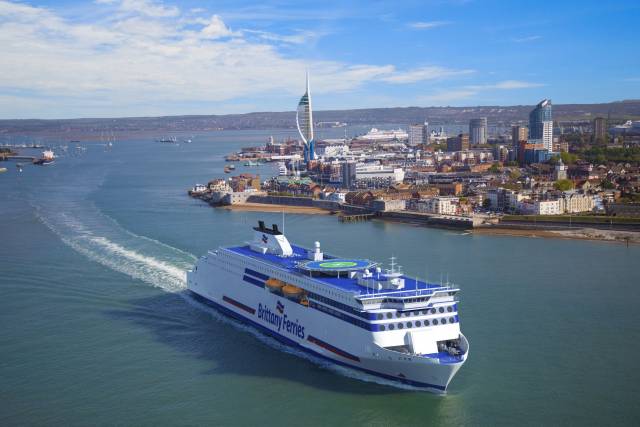 A visual montage of how Brittany Ferries newbuild of the Stena E-Flexer series will be when introduced on the long-haul UK-Spain routes, among them Portsmouth (above) which will be the hub-port for both sisters with the first due in service in 2021. Afloat also adds directly beyond the newbuild in the background is the current main Portsmouth-Spain cruiseferry, Cap Finistère seen arriving to the ferryport. 
