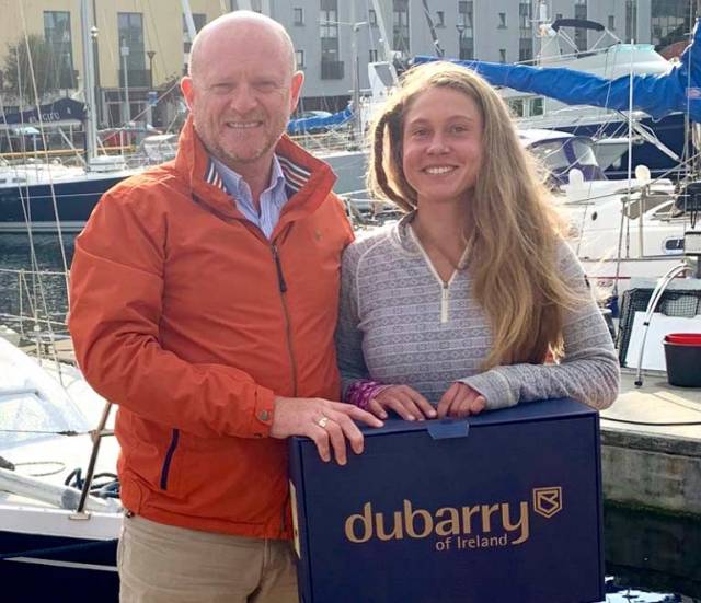 Michael Walsh of Dubarry presented Belgian solo sailor Caroline Adriens with a very practical gift of the latest Dubarry Shamrock Boots in Galway before she departed south on her dream voyage