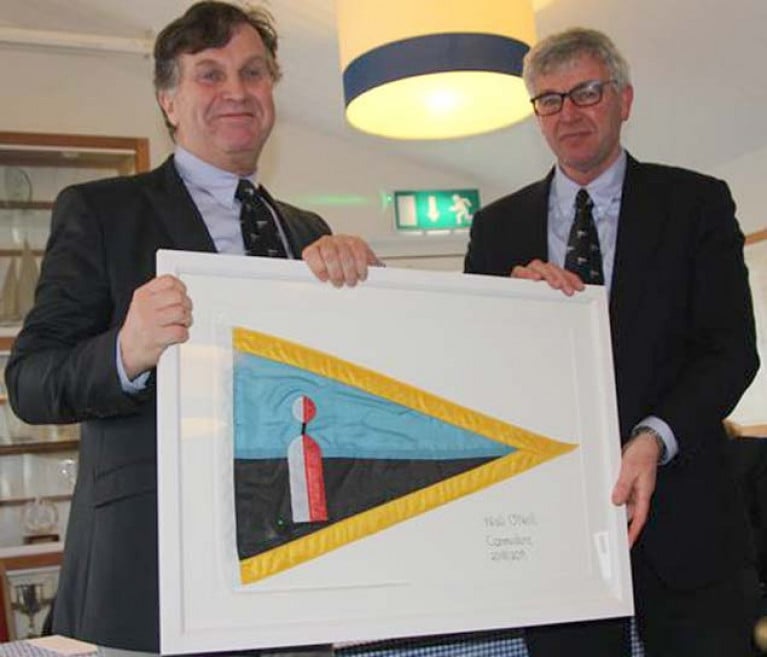 Baltimore Sailing Club’s newly-elected Commodore, Charlie Bolger, on right, presents past Commodore’s Club Ensign to outgoing Commodore Niall O’Neill at the club’s annual general meeting this week