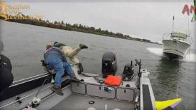 Three people are seen in still from video posted on magazine Salmon Trout Steelheader&#039;s Facebook page jumping into Columbia River at its mouth at the Pacific Ocean in Oregon in August 2017 moments before speeding boat barrelled down on theirs and hit it 